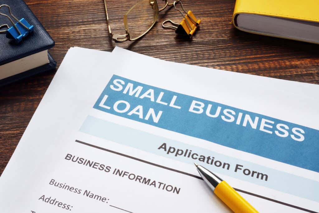 Small business application form with pen